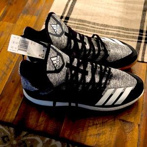 Black and white adidas metal spike baseball